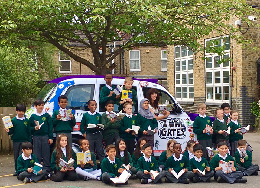 Kids with their free books - and a furry taxi.